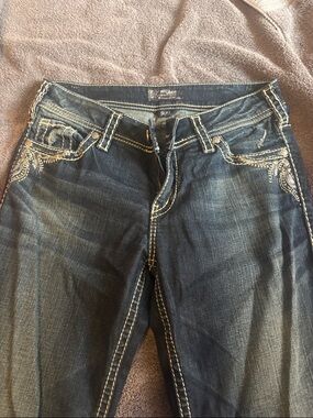 Silver Jeans Dark Blue Bootcut Jeans with Embroidered Pocket Detail